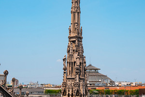 a pinnacle rises over Milan and the Galleria, a Photo by Nito