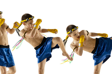 Little boy exercising thai boxing on white background. Fighter practicing, trai, a Sports & Recreation Photo by Volodymyr Melnyk