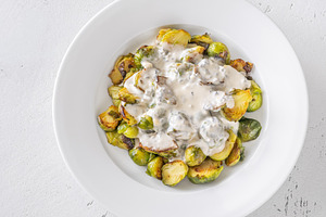 Roasted Brussels sprouts with creamy blue cheese sauce in white, a Food & Drink Photo by Alexander Prokopenko
