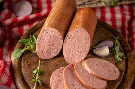 Savory sausages, is presented sliced, a Photo by Grafvision photography