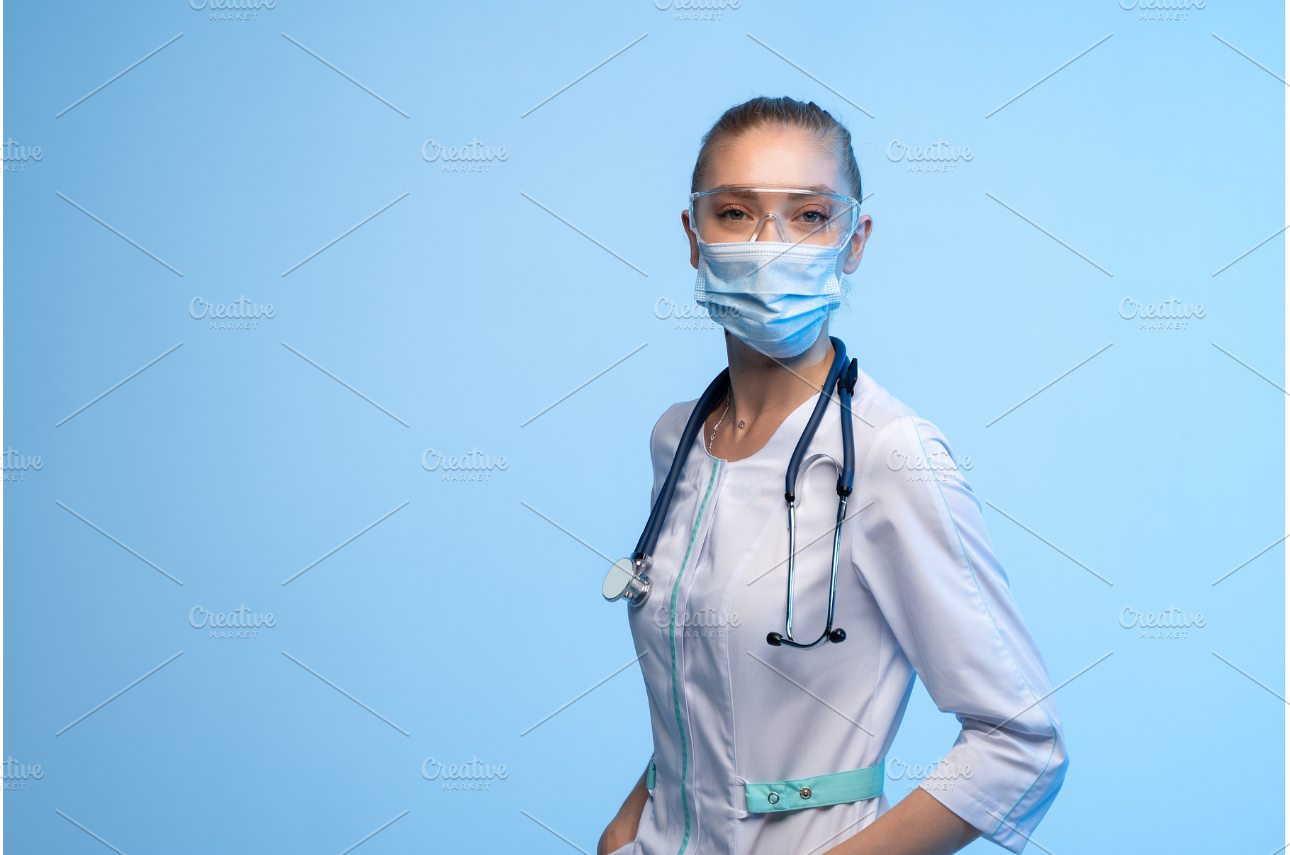 Female doctor wearing face mask and, a Health & Medical Photo by volodymyrshtun13795