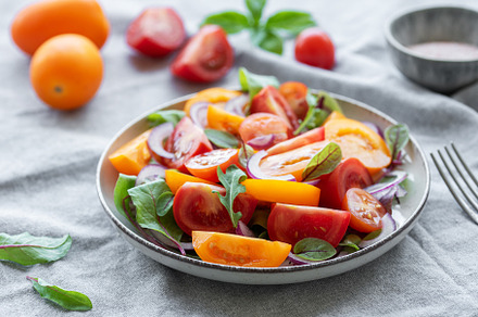 Green salad from leaves and tomatoes, a Food & Drink Photo by Olena Rudo