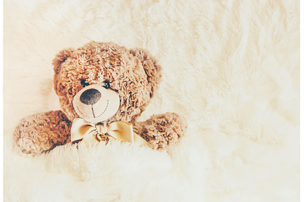 children's toy sleeps under the, an Abstract Photo by yanadjana