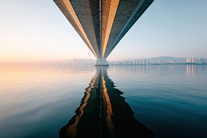 Serene bridge reflection at sunrise, an Architecture Photo by AlyaAnd