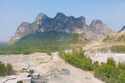 Aerial view of machine excavator trucks dig coal mining or ore w, a Background Photo by Tampatra
