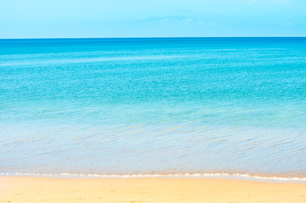 Blue sea water and sand beach, a Nature Photo by Vapi