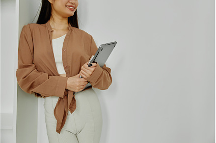 Unrecognizable smiling woman holding