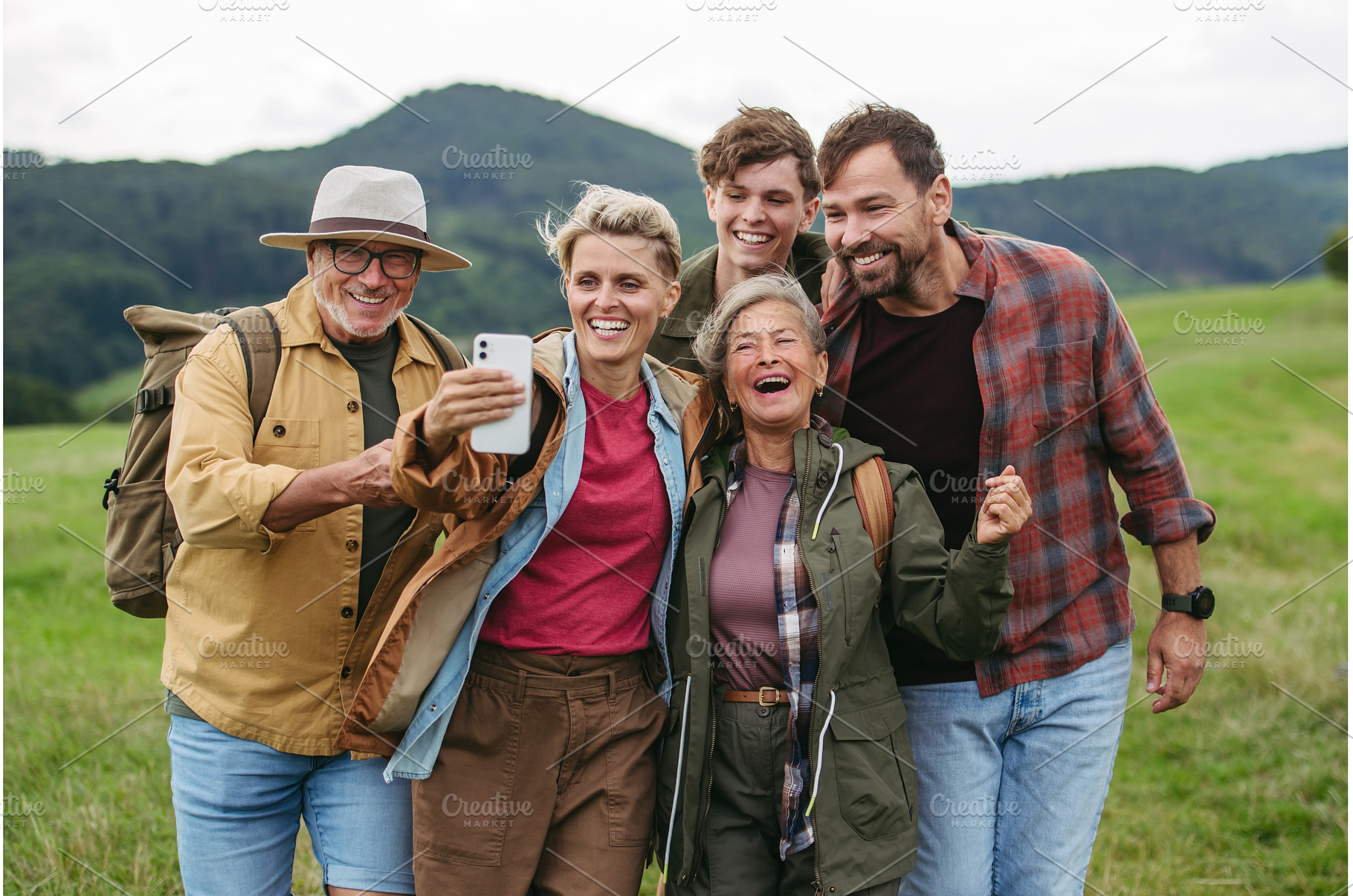 Family taking selfie on hiking trip, a Holiday Photo by HalfPoint