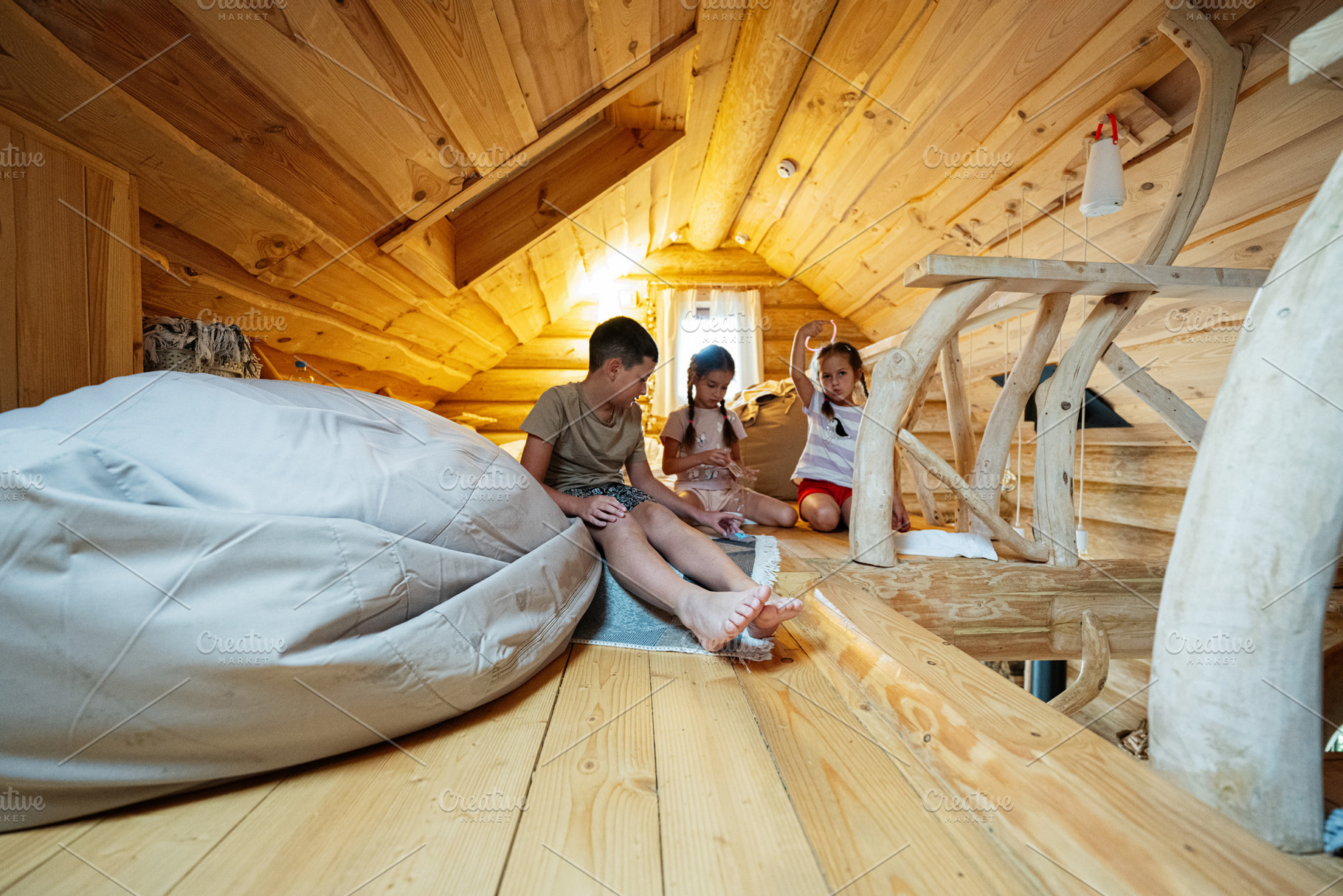Wooden loft interior with children playing and relaxing, a Photo by AS photostudio