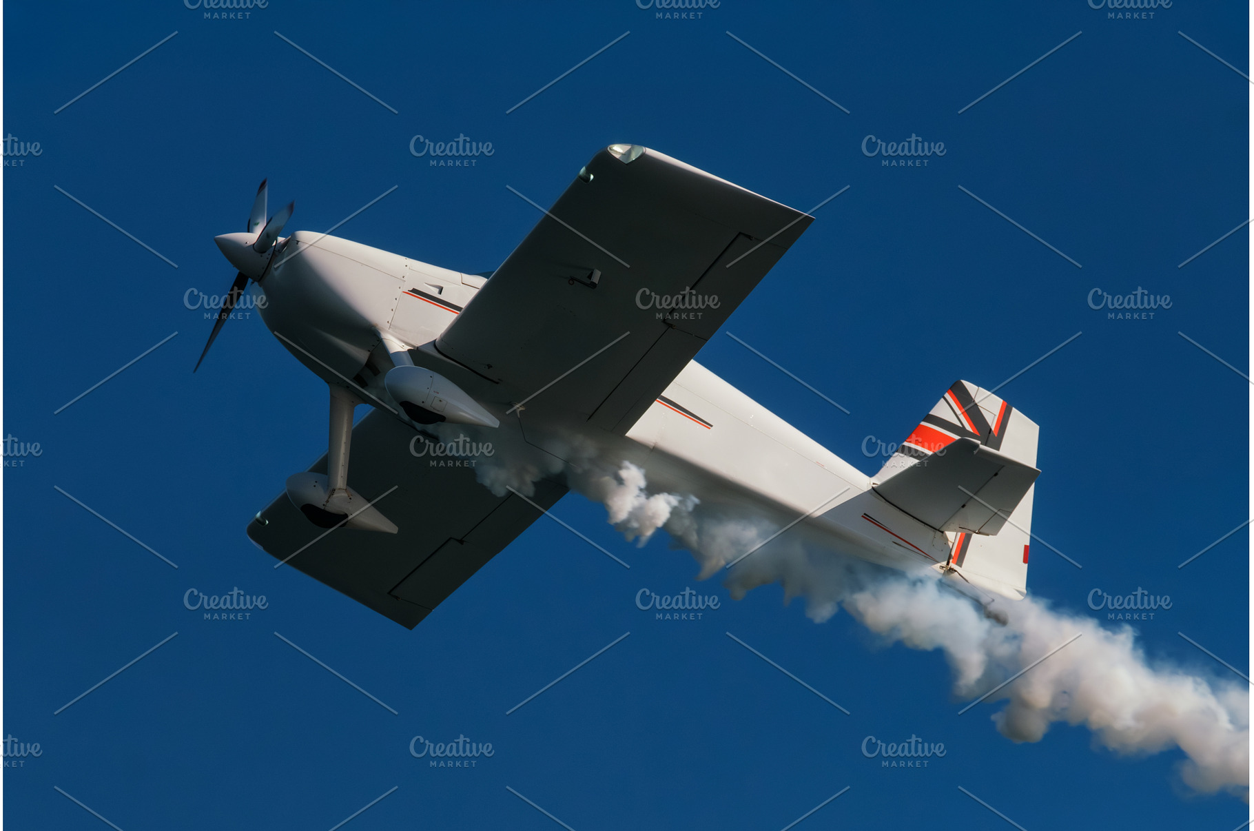 Stunt aerobatic plane performing, a Nature Photo by f9photos