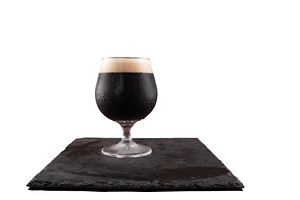 A glass of dark beer on a white, a Food & Drink Photo by Stockphoto by vzwer