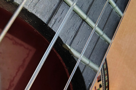 Close-up, high-angle detail shot of a classic spanish guitar, an Arts & Entertainment Photo by DanFLCreativo