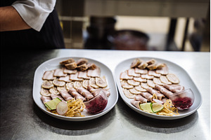Two plates of assorted meat, a Food & Drink Photo by Red Hot Chili Pepper Shop