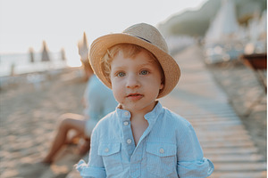 A small toddler boy standing on, a Person Photo by HalfPoint