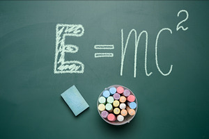A school board with an equation written in chalk expressing the, a School & Education Photo by ndanko