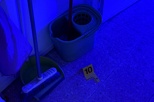 Crime scene investigation with evidence marker and cleaning tools