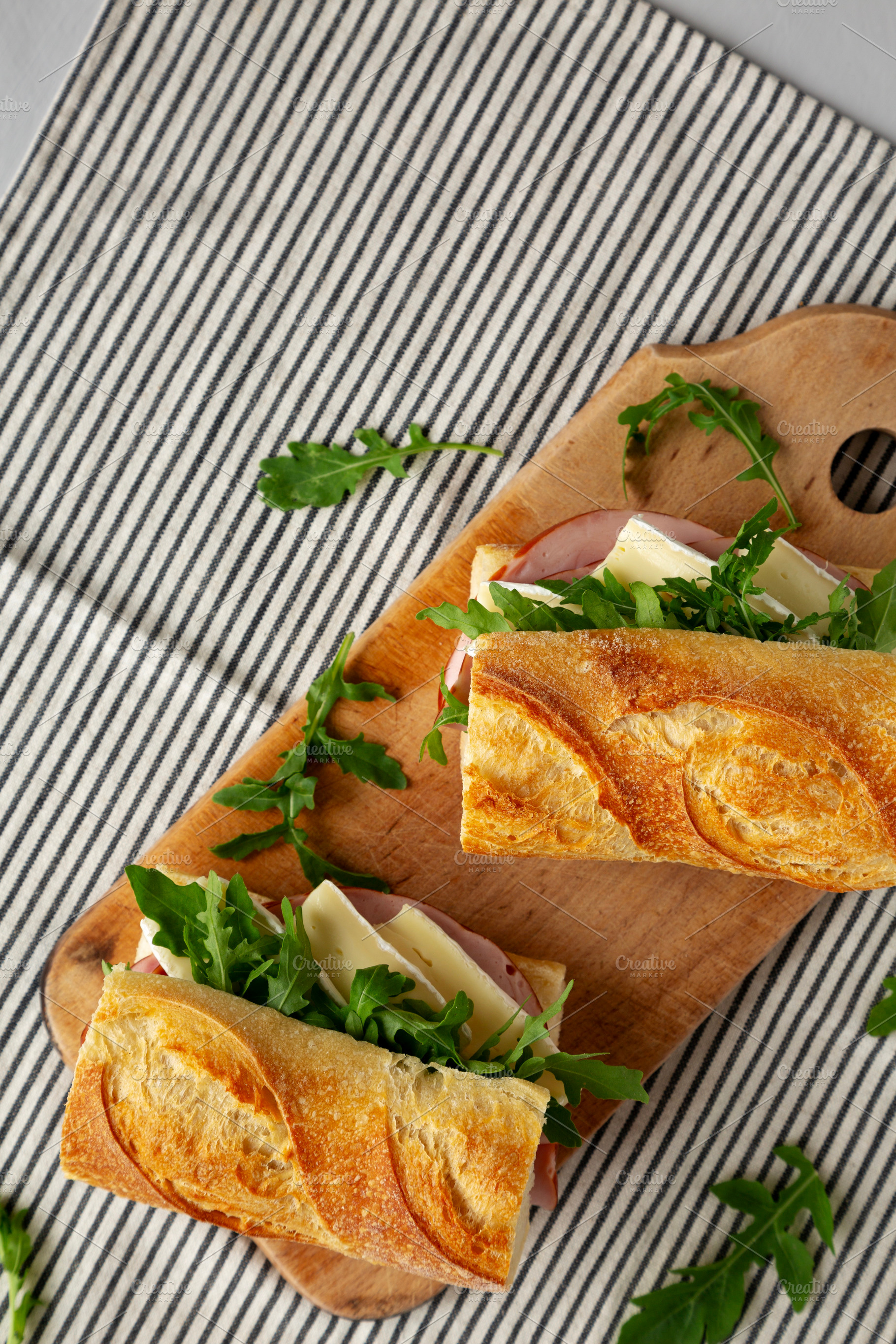 Homemade French Ham and Brie Baguette with Arugula Greens, top v, a Food & Drink Photo by LiudmylaChuhunova