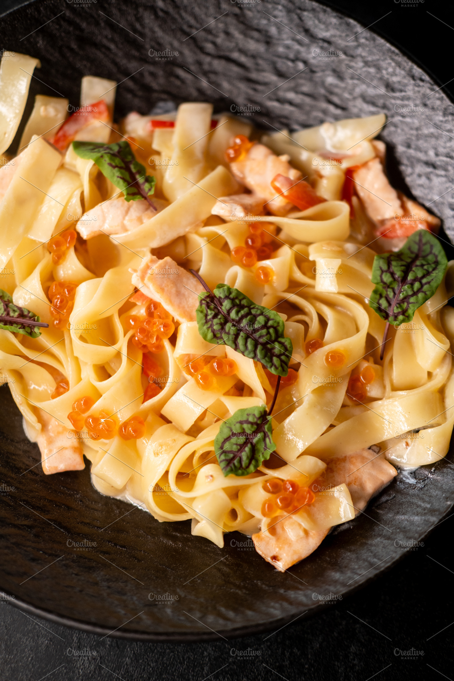 Creamy tagliatelle italian cuisine salmon leaves, a Food & Drink Photo by Photo Drive Studio