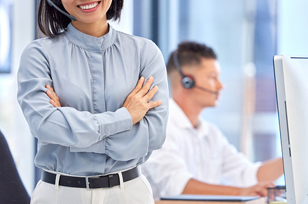 Call center, customer support and portrait Asian woman in the office, working with smile on face. Leadership, management and businesswoman standing in crm, telemarketing and customer service company, a Photo by Peopleimages.com