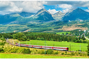 Passenger train in the high tatra mountains slovakia featuring train, a Transportation Photo by Leonid Andronov
