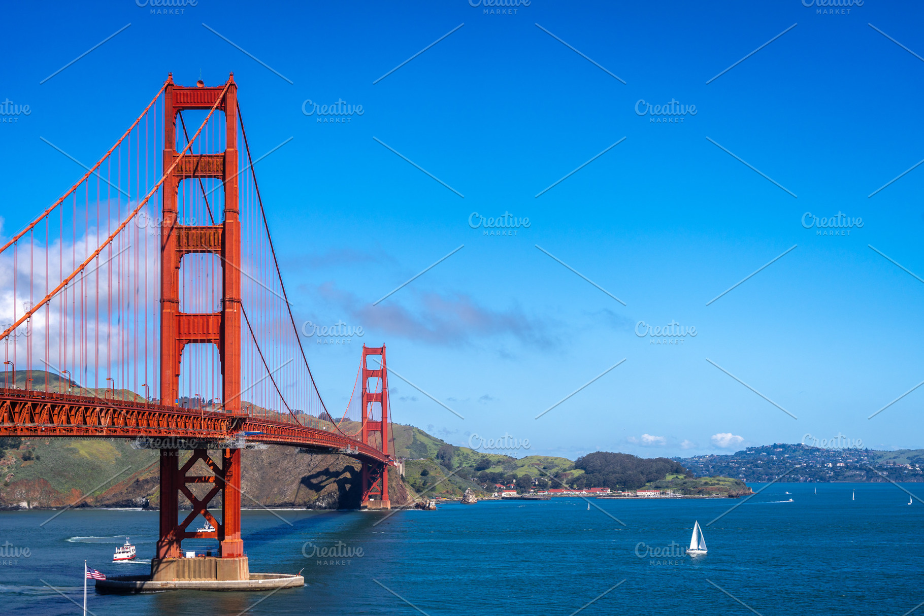 Golden Gate Bridge over blue waters with scenic hills in San Fra, an Architecture Photo by GoodGoods