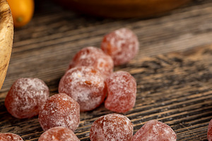 fresh kumquat and dried with powdered sugar kumquat, dehydrated and fresh kumqu, a Photo by rsoollAI