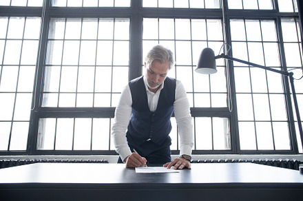 Business man signing contract making, a Business Photo by OPOLJA