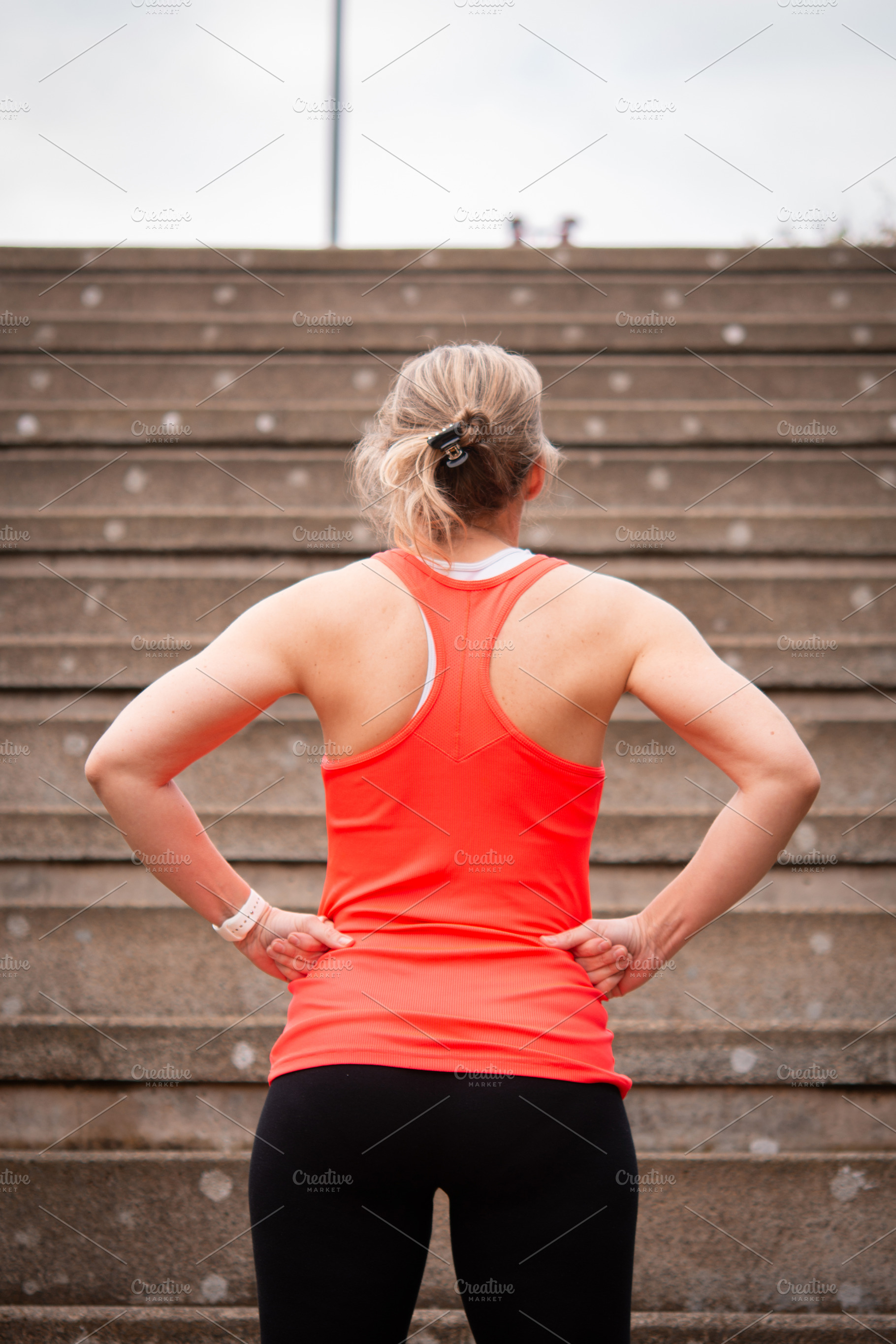 Fitness woman resting and looking at stairs before workout outdoor, a Person Photo by etorres69