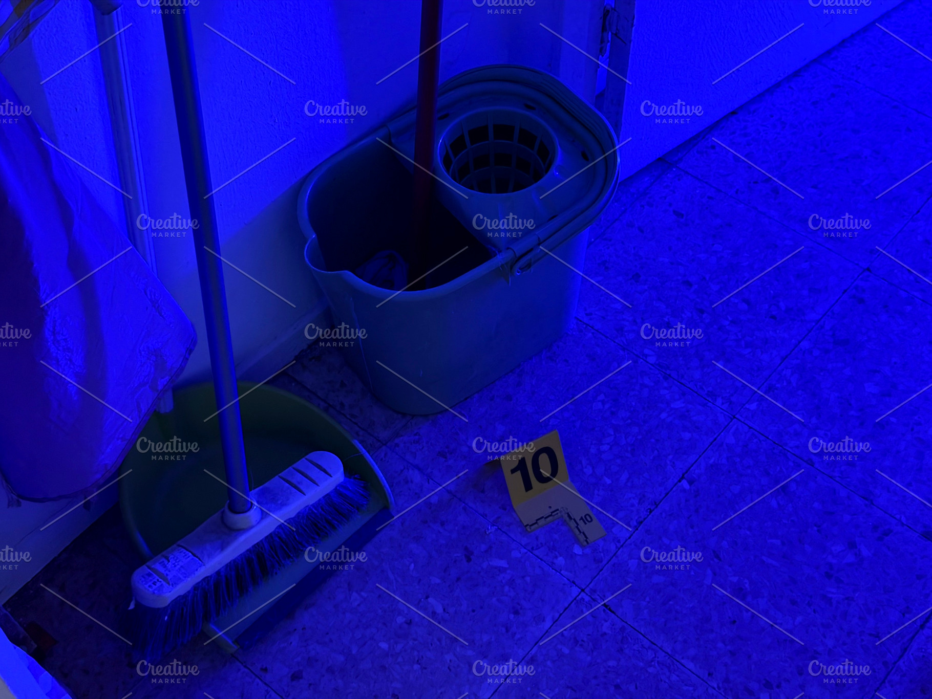 Crime scene investigation with evidence marker and cleaning tools, an Industrial Photo by karrastock