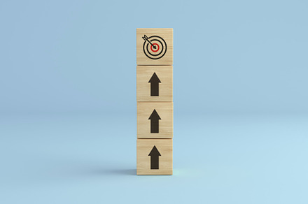 Target up. Arrow up blocks tower., a Business Photo by Zama Studio