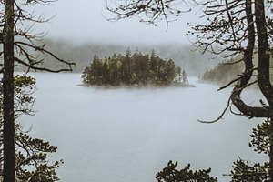 Small cozy island stock photo containing lake and small cozy island