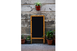 Blank chalkboard stand with wooden, an Architecture Photo by volodymyrshtun13795