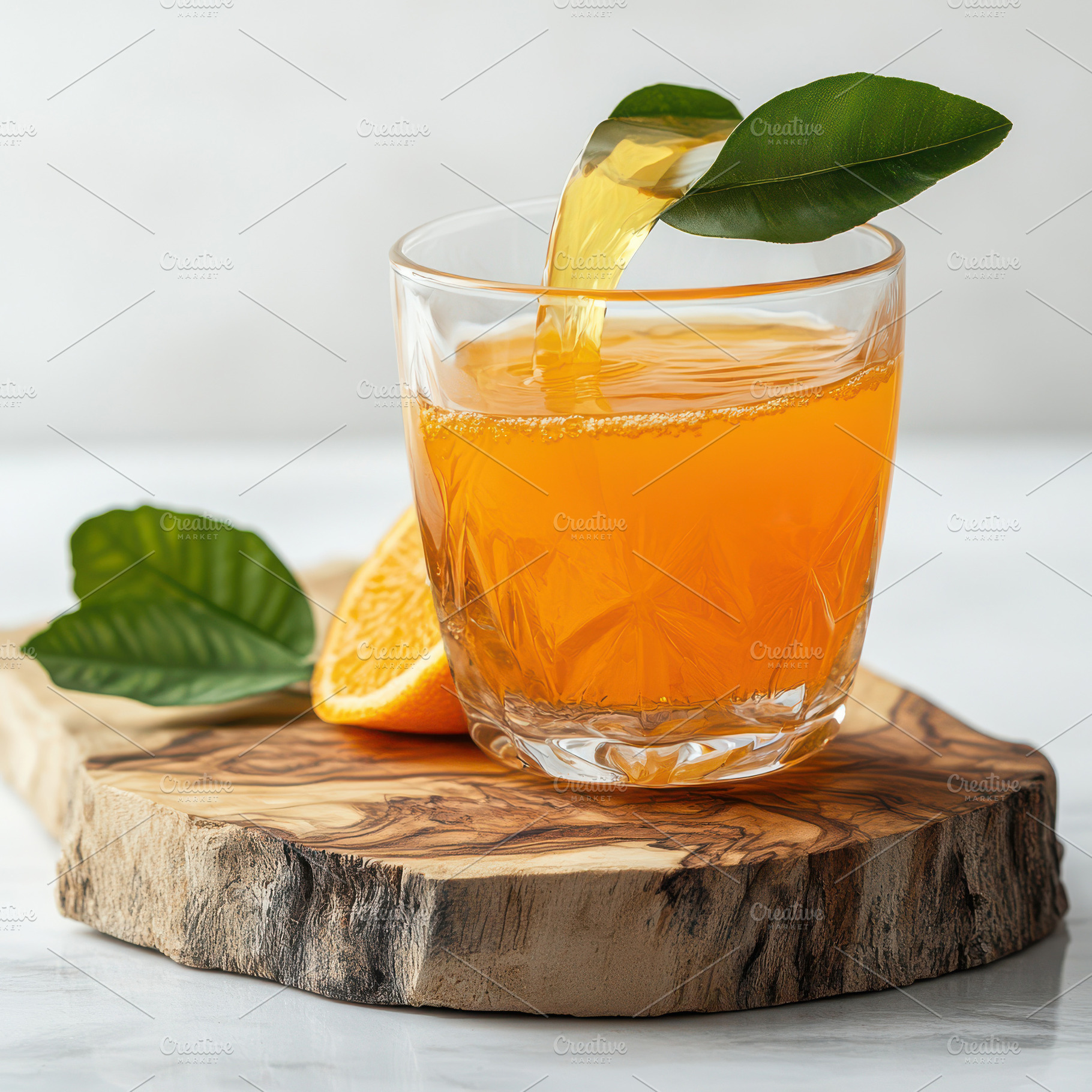 Orange juice pouring into glass on w, a Food & Drink Photo by Pixeness Studio