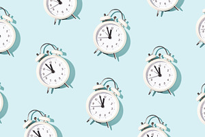 Pattern made of white alarm clocks featuring clock, pattern, and alarm