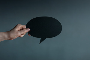 Holding blank speech bubble in dark , Social pressure, emotional, a Photo by salmon.black