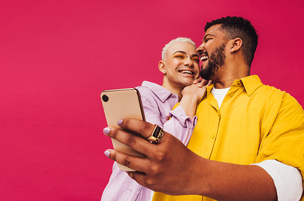 Happy gay couple taking a selfie together, a Person Photo by Jacob Lund