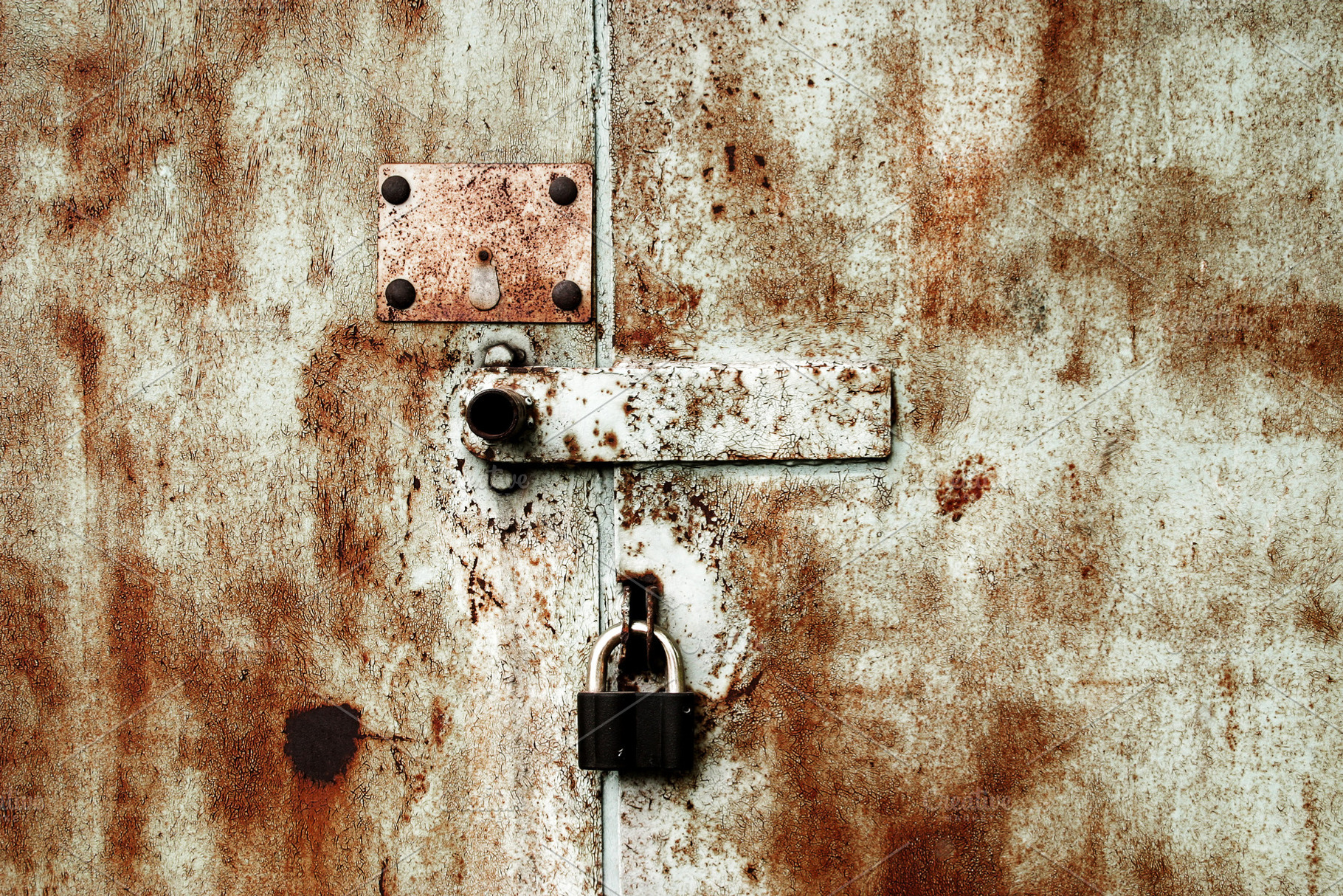 Old rusty lock on the door, a Photo by saiko3p
