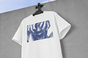 Realistic T-shirt On Wall Mockup