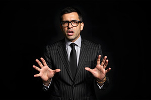 Scared Businessman in Suit Gesturing, a Business Photo by Stock Shape