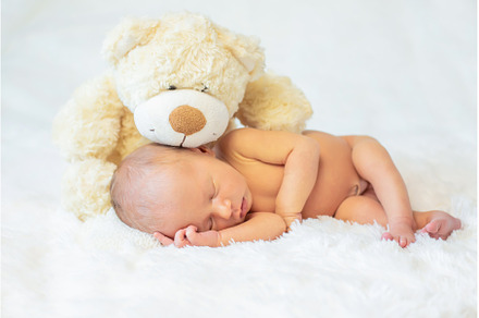 A newborn baby sleeps with a teddy, a Person Photo by yanadjana