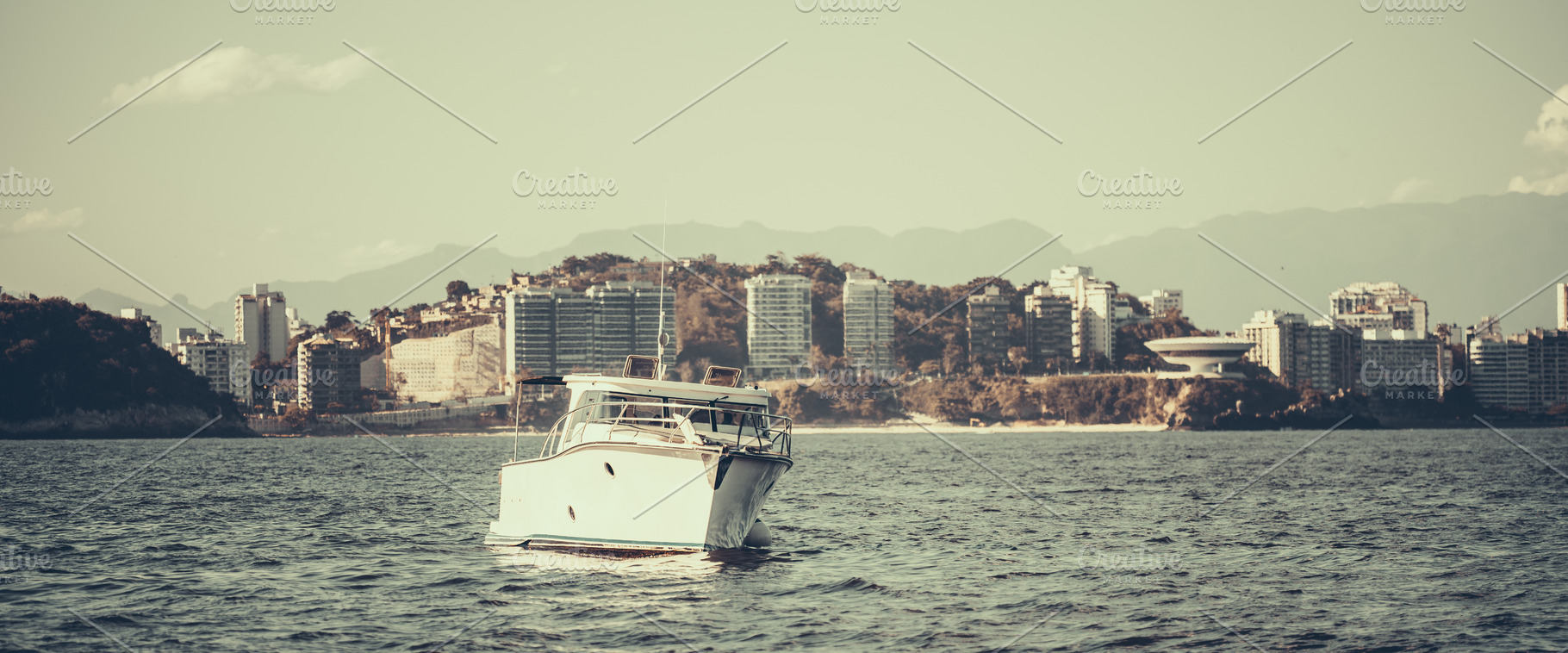 Boat on sea with city skyline, a Transportation Photo by SkyNext