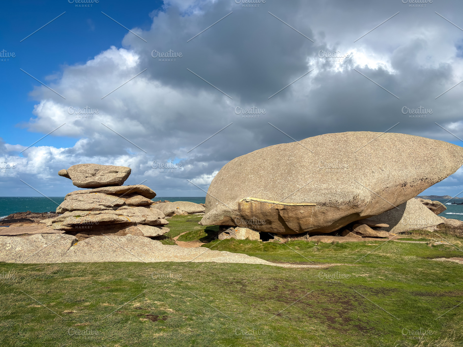 Balanced granite stacks beside large boulder in Tregastel Britta, a Nature Photo by GoodGoods