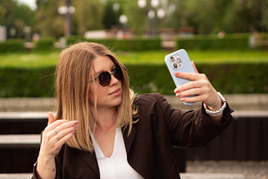 Young woman smiling with sunglasses, a Person Photo by Elena Vagengeim