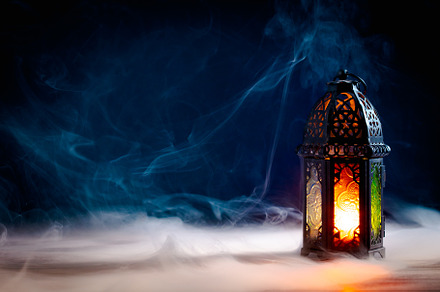 Ramadan Kareem greeting card design. Arabic Lantern glowing at night on table w, a Holiday Photo by photoguns