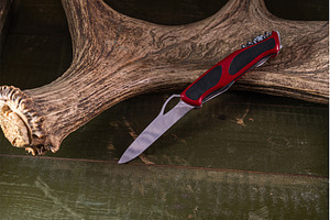 Folding pocket knife with red handle, an Industrial Photo by Stockphoto by vzwer