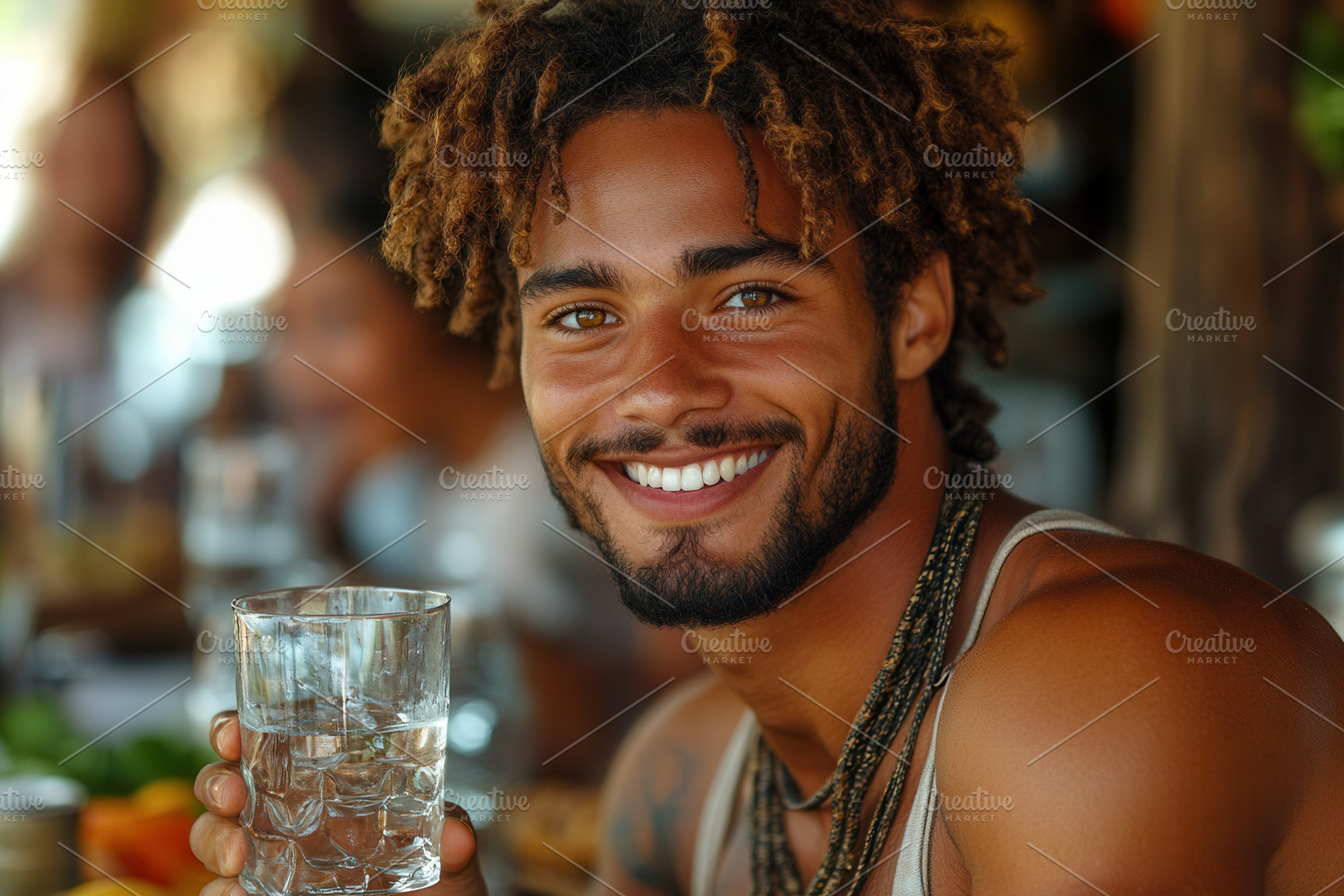 Smiling young man holding a glass of, a Photo by Tanuart