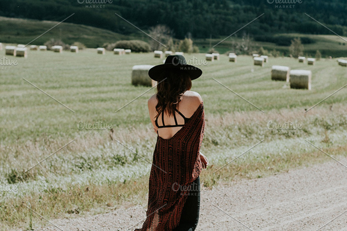 Woman walking down the road, a Person Photo by Wild Wander Collective (Photo 1 of 2)