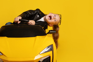 Young girl in black leather jacket leaning to the side and laugh, a Person Photo by Ales Munt