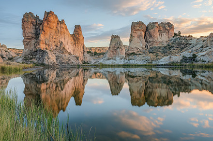 Stunning sunset over rock formations, a Photo by Tanuart