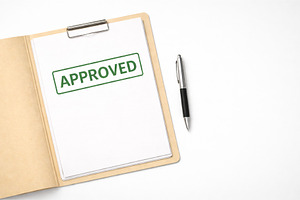 Approved document with clipboard and, a Photo by Dvoevnore photos